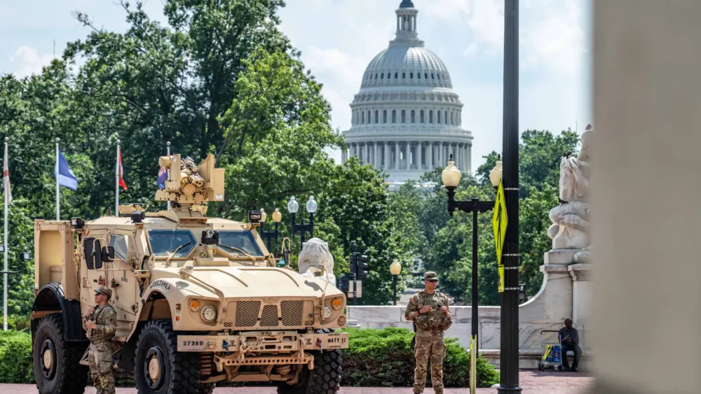 U.S. Soldiers with the District of Columbia National Guard stand watch in support of Joint Task Force–District of Columbia during the DC Safe and Beautiful mission in Washington, D.C., Aug. 16, 2025. Guard members are positioned at key locations throughout the city to provide a visible security presence alongside law enforcement partners. (U.S. Army photo by Sgt. Aaron Troutman)
