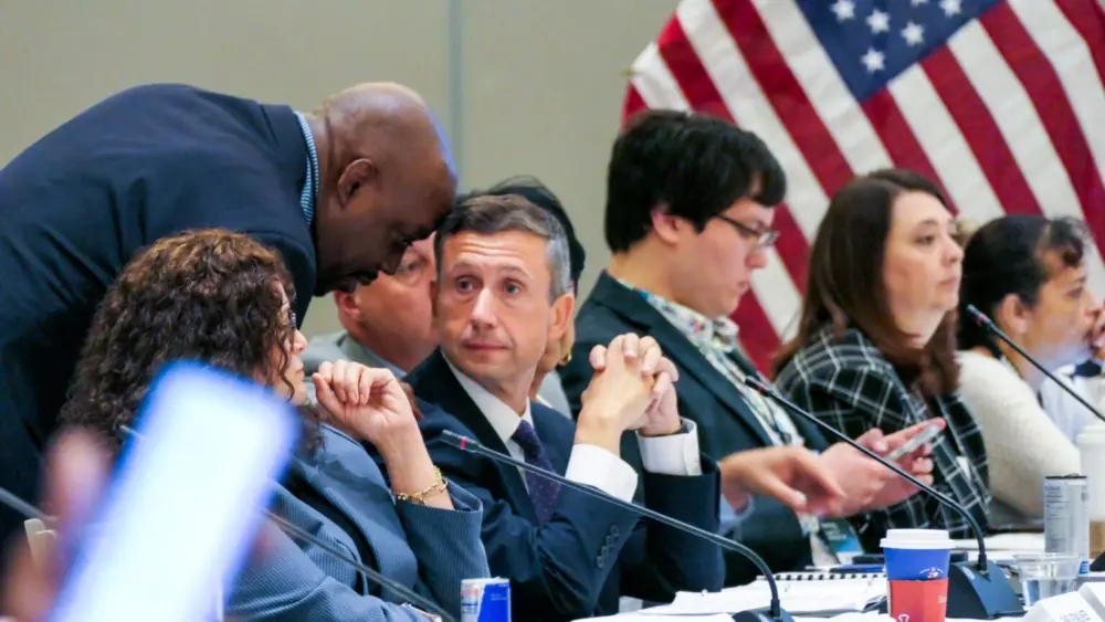 A delegate speaks to Ken Martin, chair of the Democratic National Committee, before he withdraws his resolution calling for a ceasefire in Gaza during a meeting of the Resolutions Committee at a Democratic National Committee meeting Tuesday, Aug. 26, 2025 in Minneapolis, Minnesota. (Photo by Nicole Neri/Minnesota Reformer)