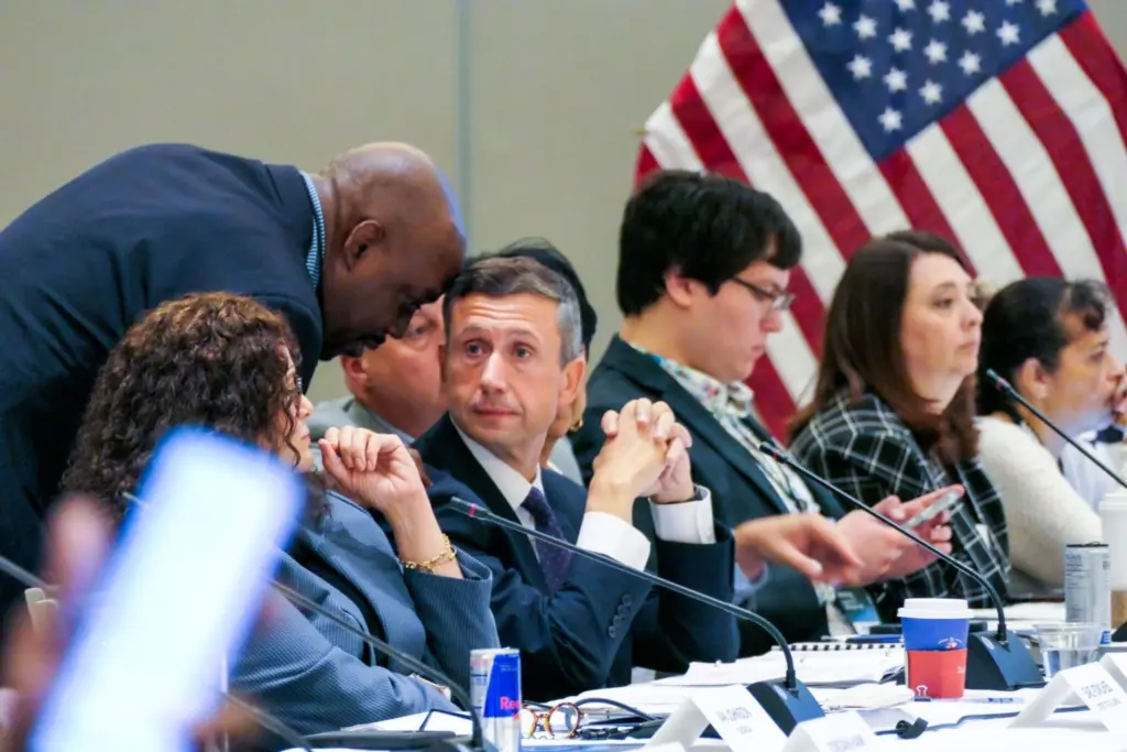 A delegate speaks to Ken Martin, chair of the Democratic National Committee, before he withdraws his resolution calling for a ceasefire in Gaza during a meeting of the Resolutions Committee at a Democratic National Committee meeting Tuesday, Aug. 26, 2025 in Minneapolis, Minnesota. (Photo by Nicole Neri/Minnesota Reformer)