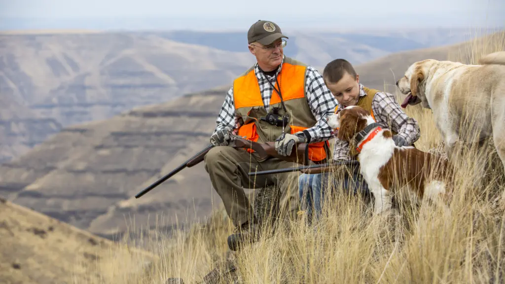 Father and son upland bird hunting, Lewiston, Idaho region. - Idaho Fish and Game