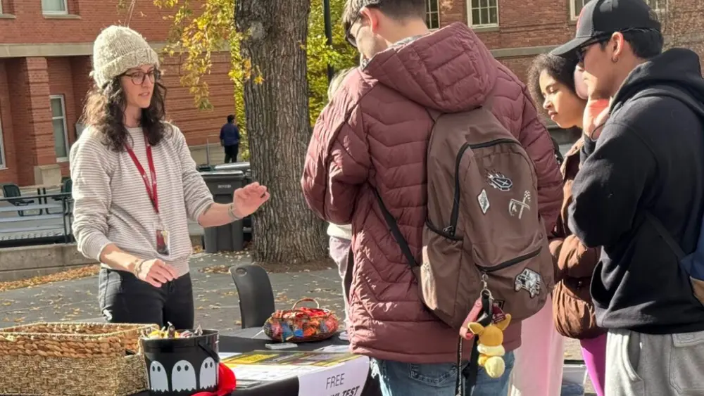 Tabling on the Terrell Mall is one of many ways Cougar Health Services educates students and the broader community about opioid overdose prevention. The low-pressure environment encourages students to ask questions and take free fentanyl test strips (photo by Student Affairs/WSU).