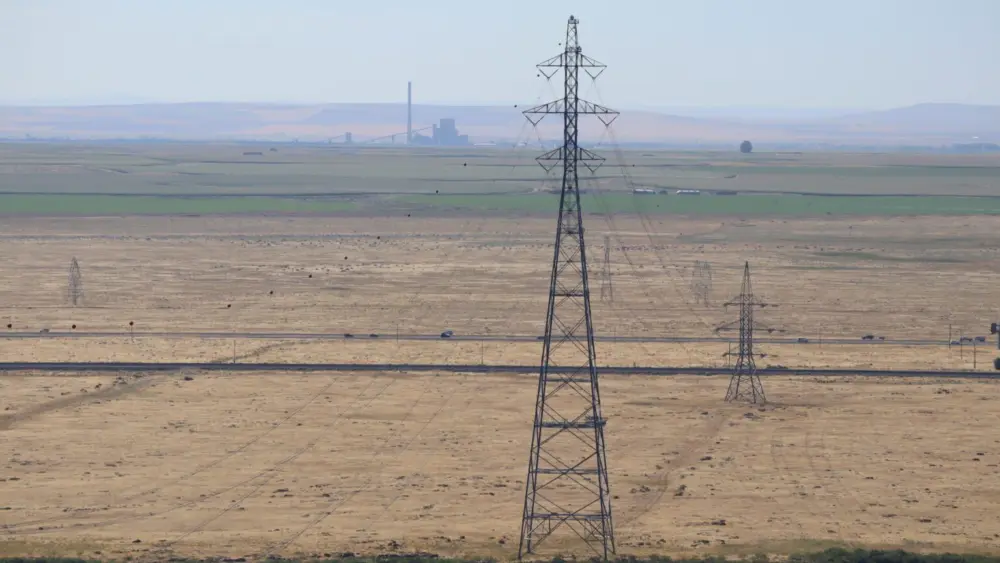 Portland General Electric’s Boardman energy complex in the distance, as seen from Crow Butte across the Columbia River in 2019. (Photo by Tom Banse)
