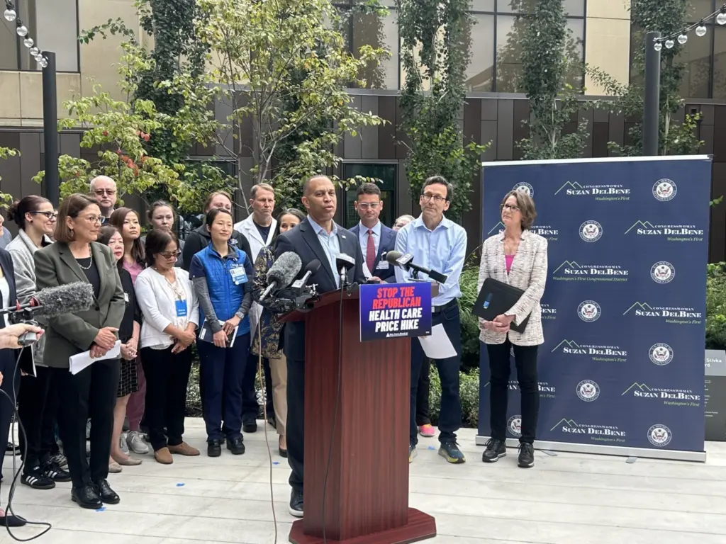 U.S. House Democratic Leader Hakeem Jeffries speaks about rising insurance costs along Gov. Bob Ferguson, U.S. Rep. Suzan DelBene and others at Overlake Medical Center in Bellevue, Washington, on Friday, Sept. 12, 2025. (Photo by Jake Goldstein-Street/Washington State Standard)