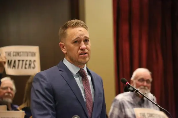 Daniel Mooney, president of the Committee to Protect and Preserve the Idaho Constitution, announces a lawsuit challenging House Bill 93 on Sept. 17, 2025, at the Statehouse in Boise. (Kaeden Lincoln/EdNews)