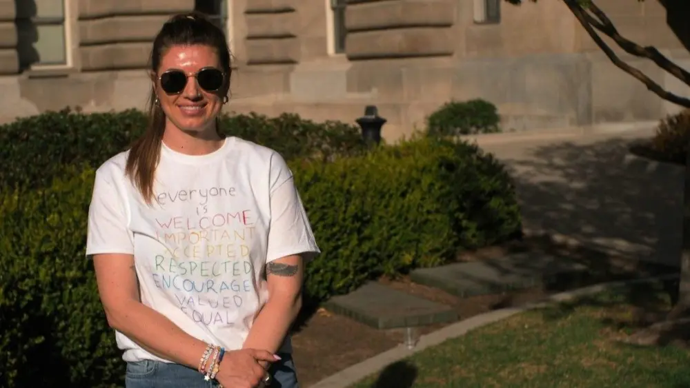 Sarah Inama stands for a portrait after speaking at an “everyone is welcome here” themed rally at the Idaho capitol building. (Kaeden Lincoln/IdahoEdNews)