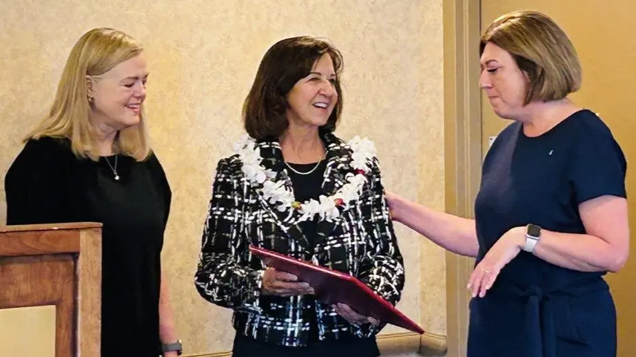 From left: Rhoda Altom ('80) congratulates Linda Pillo ('78) on her WSUAA Alumni Achievement award presented by Mariah Maki, executive director of WSU Alumni Association (photo courtesy of WSU).