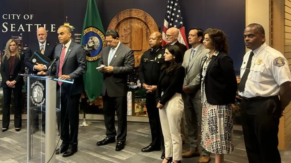Washington state Attorney General Nick Brown speaks at a press conference alongside Seattle Mayor Bruce Harrell and other local officials on Monday, Sept. 29, 2025, at Seattle City Hall. (Photo by Jake Goldstein-Street/Washington State Standard)
