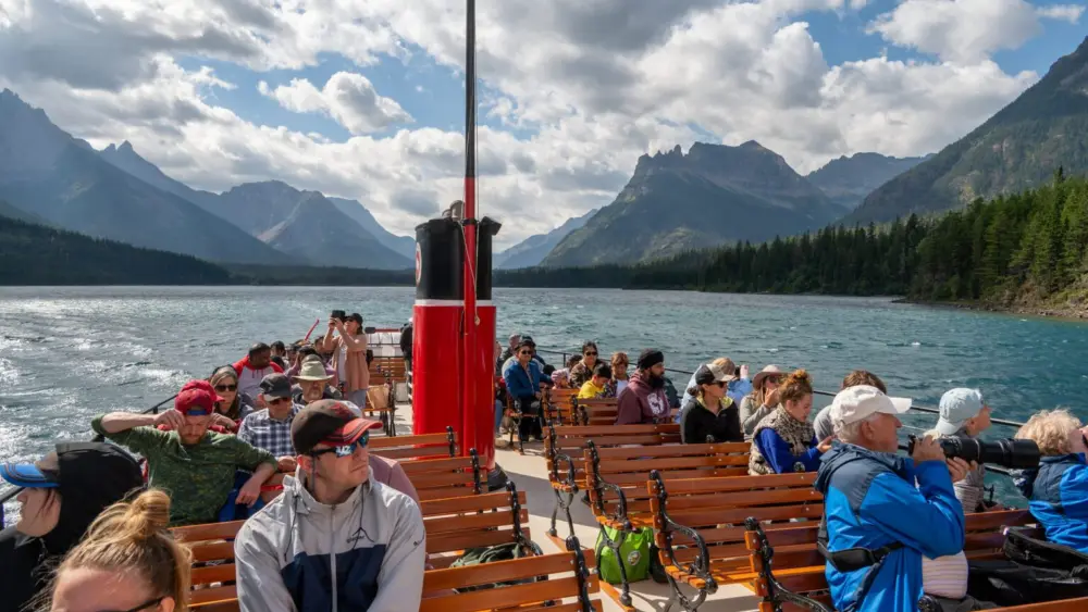 One of the boats that runs between Waterton Townsite and Goat Haunt is the International. Built in 1927, the International has carried thousands of visitors across the border during its lifetime. Passengers can disembark for a brief sightseeing opportunity, while others take the boat to start multi-day backpacking trips. (Photo by Glacier National Park / NPS)