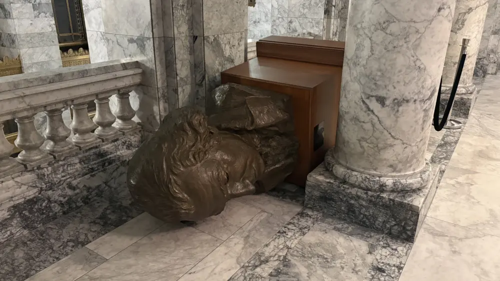 A bronze bust of George Washington lies on its side inside the Washington State Legislative Building following an act of vandalism on October 5, 2025. Photo Credit: Washington State Department of Enterprise Services