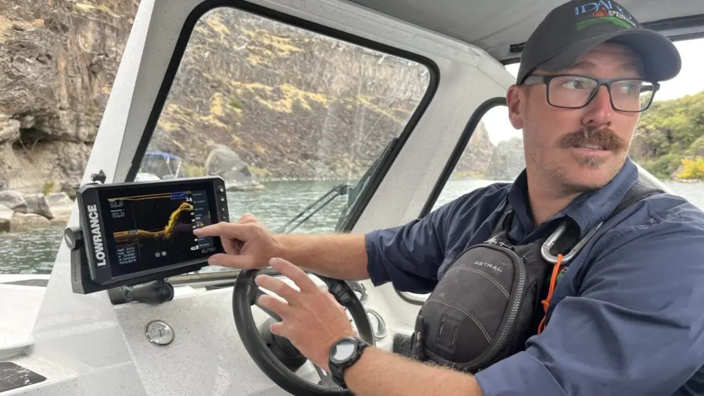 Jeremey Varley, the Idaho State Department of Agriculture’s southern chief treatment engineer, explains the state’s strategy for eradicating invasive quagga mussels during a boat tour of the infested portion of the Snake River on Oct. 3. (Photo by Clark Corbin/Idaho Capital Sun)