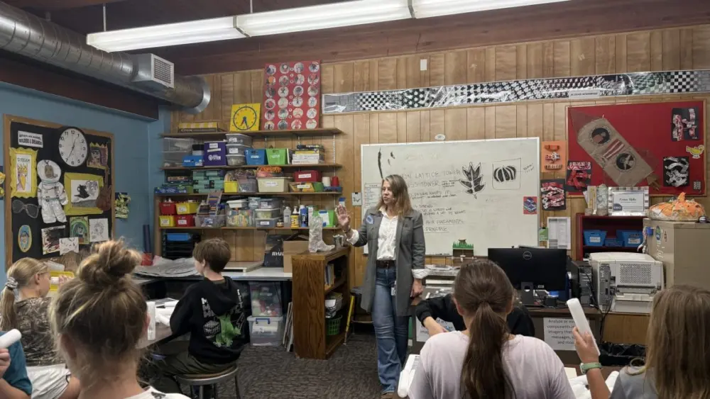 Karen Rohn gives instructions to a group of sixth graders at the start of class.