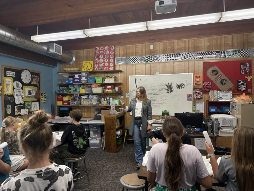 Karen Rohn gives instructions to a group of sixth graders at the start of class.