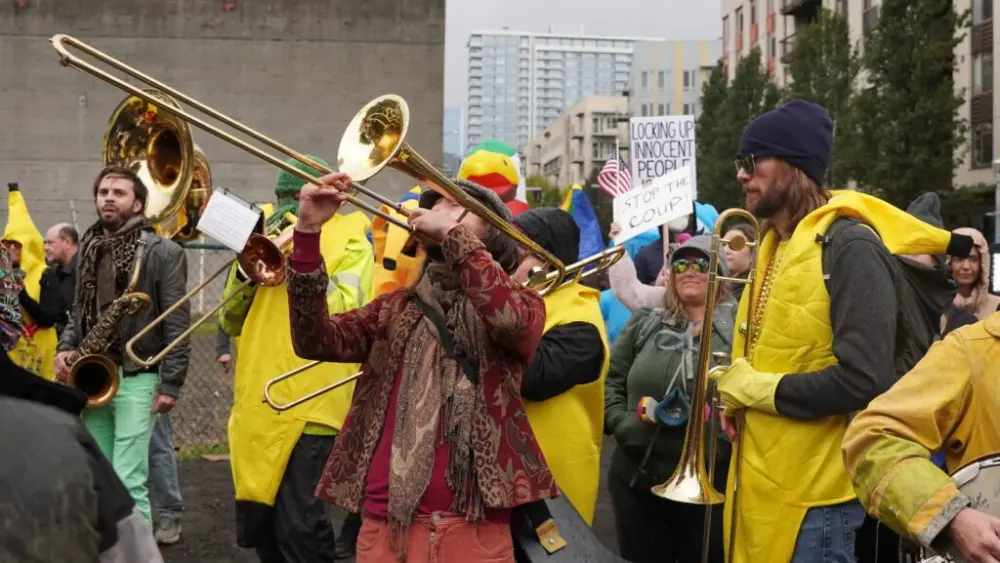A band plays at a protests at the Immigration and Customs Enforcement facility south of downtown Portland on Sunday, Oct. 12, 2025. (Photo by Alex Baumhardt/Oregon Capital Chronicle)