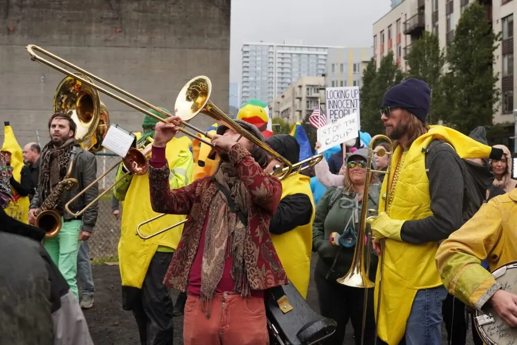 A band plays at a protests at the Immigration and Customs Enforcement facility south of downtown Portland on Sunday, Oct. 12, 2025. (Photo by Alex Baumhardt/Oregon Capital Chronicle)