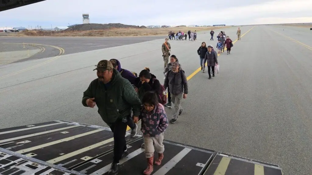 Evacuees board a C-17 military transport plane from Bethel to Anchorage on Oct. 16, 2025 (Photo by Corinne Smith/Alaska Beacon)