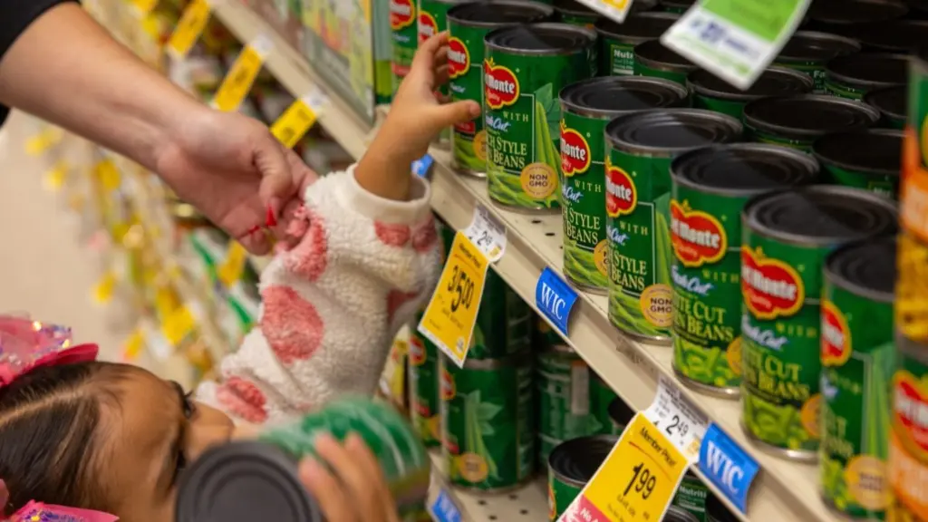 A WIC child participant takes a WIC-approved product off the shelf in a grocery store in Seattle in September 2024. (Photo by U.S. Department of Agriculture)