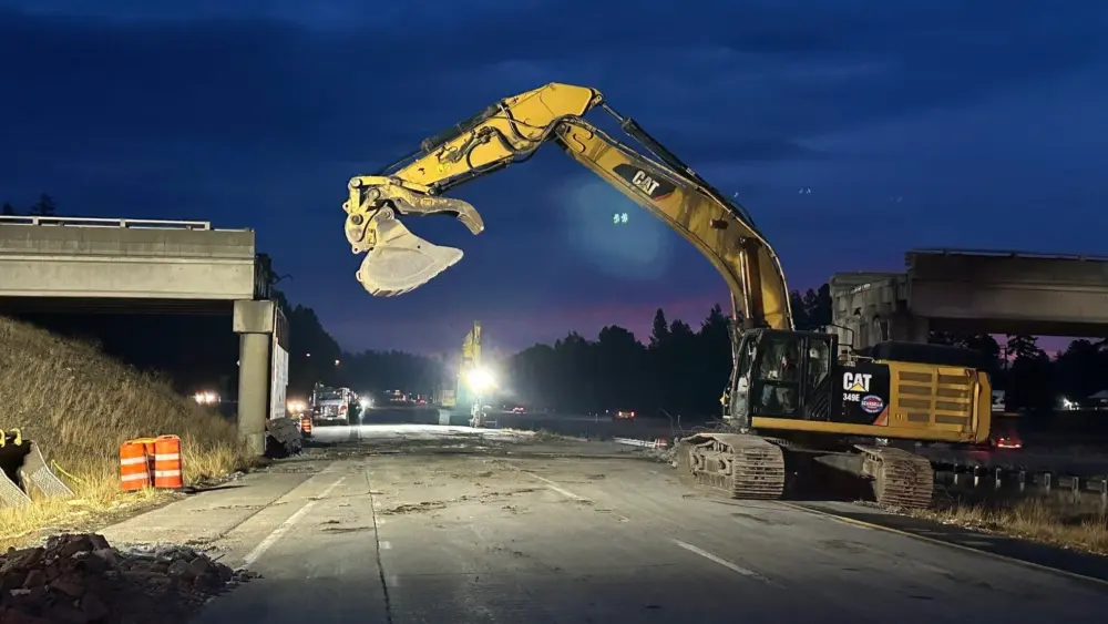 Crews clear debris after removing the damaged Bullfrog Road overpass above westbound I-90 near Cle Elum. Photo Credit: Photo courtesy of WSDOT / Screenshot from WSDOT social media page