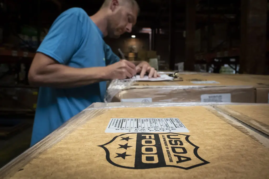 FeedMore workers receive pallets of U.S. Department of Agriculture ham. FeedMore is one of USDA’s partner agencies, located in Richmond, Virginia, providing food assistance as part of the Commodity Supplemental Food Program and The Emergency Food Assistance Program. (Photo by Preston Keres/USDA)
