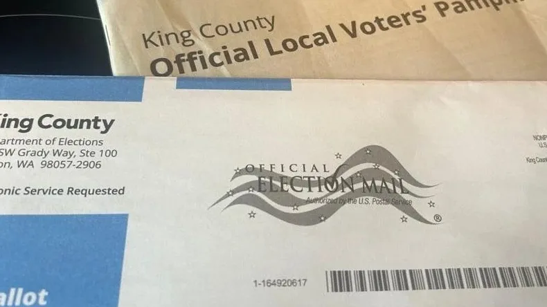 A Washington state ballot and voters pamphlet for the Nov. 4, 2025, election are shown, Oct. 30, 2025. Photo: Carleen Johnson / The Center Square
