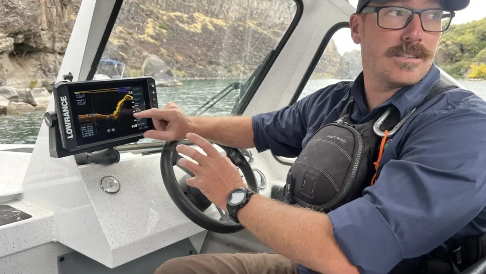 Jeremey Varley, the Idaho State Department of Agriculture’s southern chief treatment engineer, explains the state’s strategy for eradicating invasive quagga mussels during a boat tour of the infested portion of the Snake River on Oct. 3. (Photo by Clark Corbin/Idaho Capital Sun)