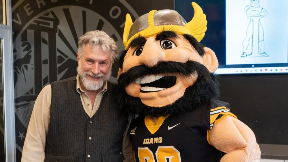 Photo credit: University of Idaho Visual Productions — Joe Vandal poses with sculptor Gareth Curtiss during a visit to Moscow in February.
