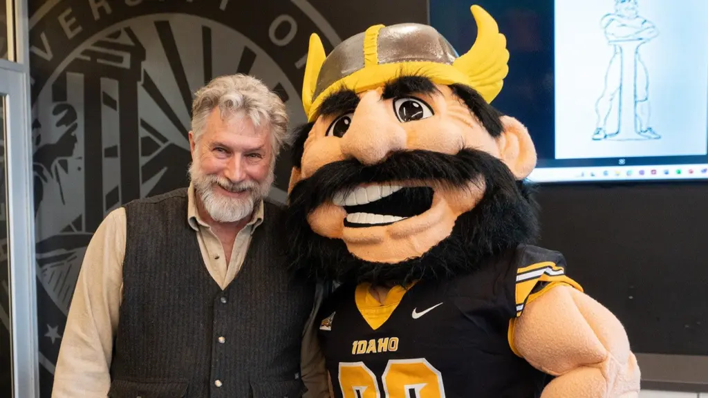 Photo credit: University of Idaho Visual Productions — Joe Vandal poses with sculptor Gareth Curtiss during a visit to Moscow in February.