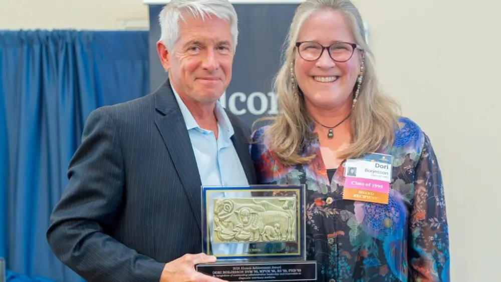 WSU College of Veterinary Medicine Dean Dr. Dori Borjesson, poses with UC Davis School of Veterinary Medicine Dean Mark Stetter, as she receives an Alumni Achievement Award Saturday, Oct. 25, on the UC Davis campus. The award is the highest honor bestowed by the school (photo courtesy Michael J. Bannasch, UC Davis School of Veterinary Medicine).
