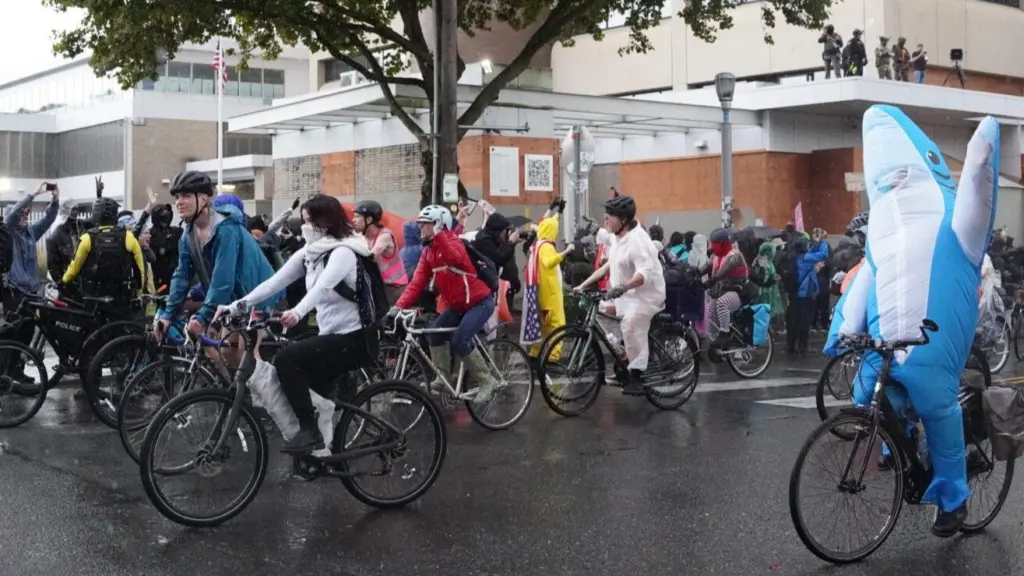 Hundreds of bike riders joined a protest at the Immigration and Customs Enforcement facility south of downtown Portland on Sunday, Oct. 12, 2025. Federal lawyers are asking an appeals court to allow them to keep 200 Oregon National Guard troops federalized while President Donald Trump and Defense Sec. Pete Hegseth continue to try and deploy them to the ICE facility. (Photo by Alex Baumhardt/Oregon Capital Chronicle)