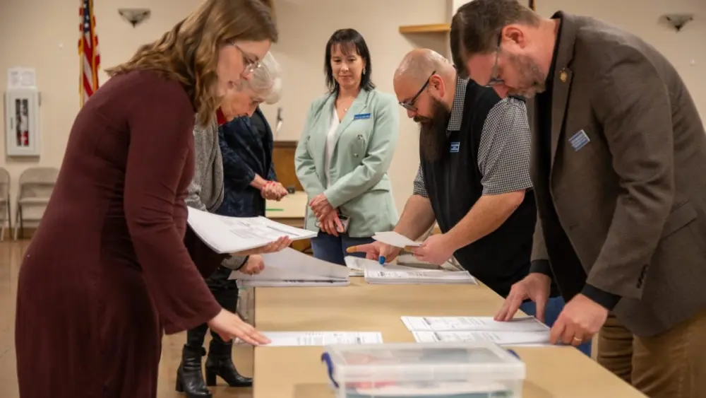 Election officials from the Secretary of State’s Office hand count ballots in Elmore County on Monday, Nov. 24, 2025, at the Elk’s Lodge in Mountain Home. (Sean Dolan/EdNews)