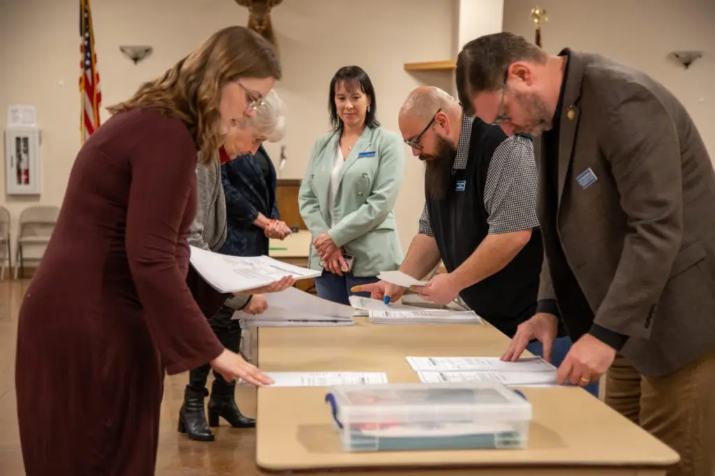 Election officials from the Secretary of State’s Office hand count ballots in Elmore County on Monday, Nov. 24, 2025, at the Elk’s Lodge in Mountain Home. (Sean Dolan/EdNews)