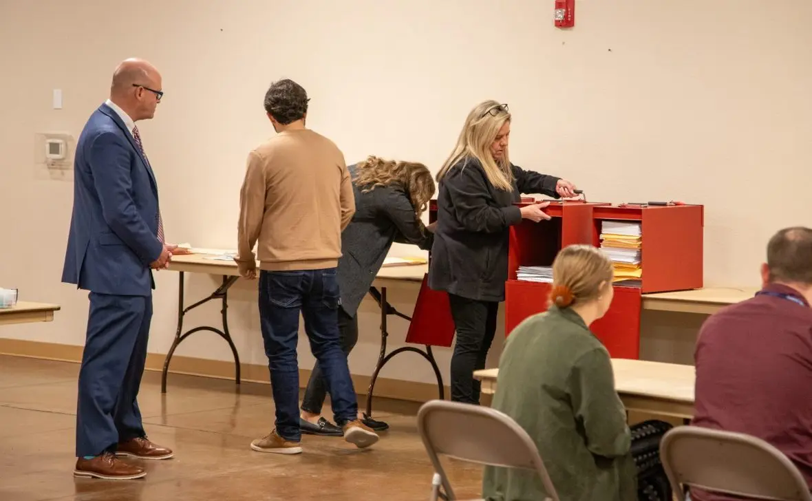 Elmore County Clerk Shelley Essl opens up red boxes containing 3,000 ballots at the Elk’s Lodge in Mountain Home for a hand recount on Monday, Nov. 24, 2025. (Sean Dolan/EdNews)
