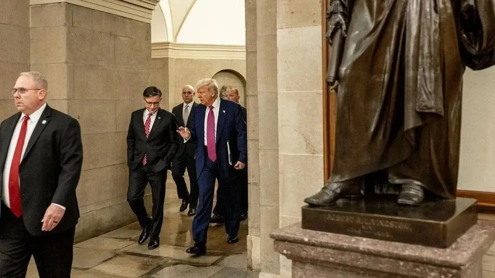 President Donald Trump and House Speaker Mike Johnson walk through the U.S. Capitol, May 20, 2025. Photo: Molly Riley / Official White House Photo via Flickr / United States Government Work