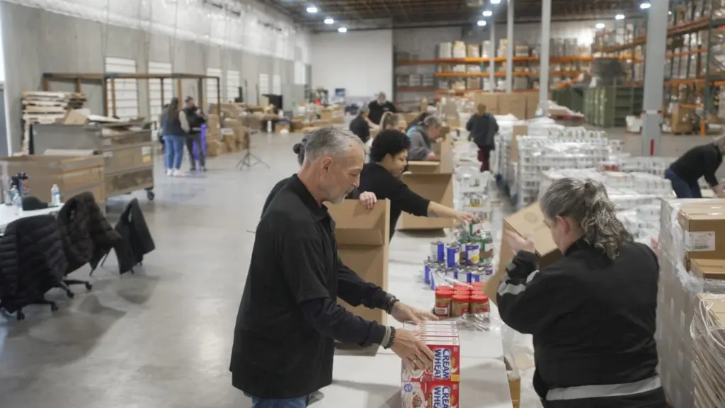 Employees with the Oregon Office of Resilience and Emergency Management pack food boxes at a warehouse in Salem as part of a training to see how they can respond to future food emergencies. (Courtesy of Oregon Department of Human Services)