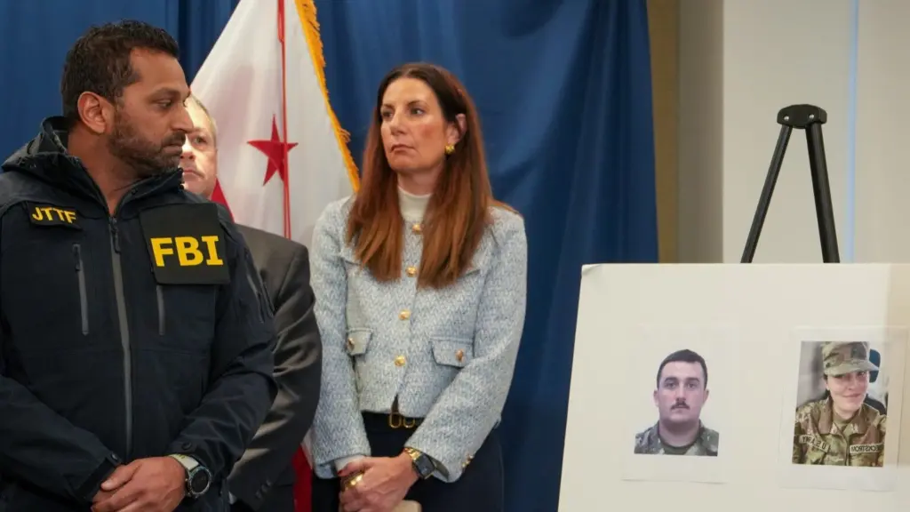 FBI Director Kash Patel, left, at a press conference on Nov. 27, 2025, looks at photos of the two West Virginia National Guard soldiers shot in Washington, D.C., the previous day. They were identified as Andrew Wolfe, 24, and Sarah Beckstrom, 20. (Photo by Andrew Leyden/Getty Images)