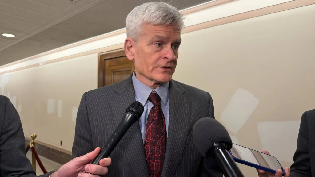 Louisiana Republican U.S. Sen. Bill Cassidy talks with reporters in the Dirksen Senate office building on Wednesday, Dec. 3, 2025. (Photo by Jennifer Shutt/States Newsroom)