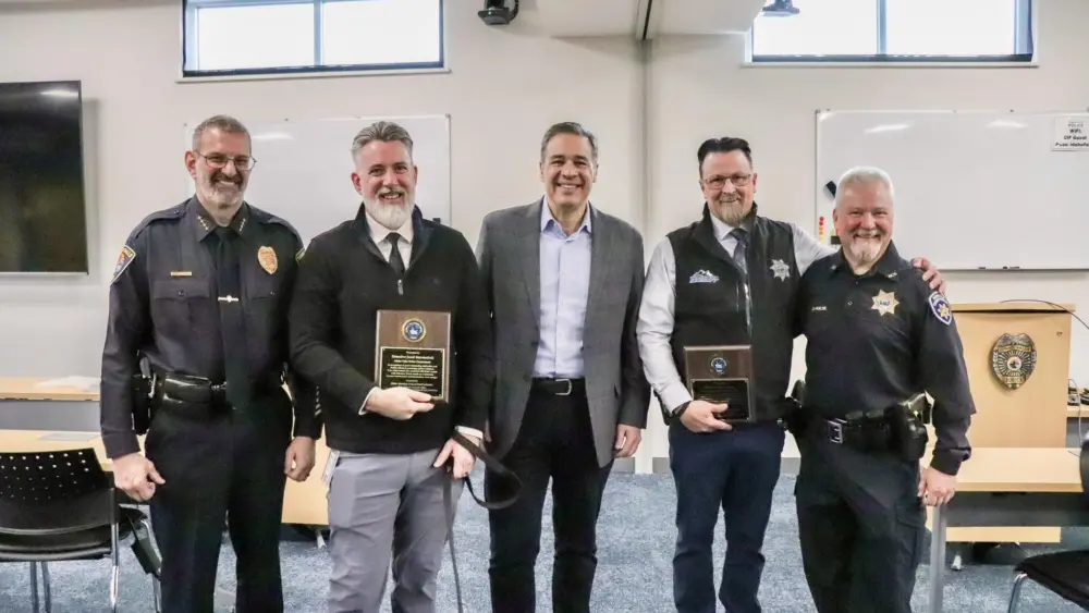 Attorney General Raúl Labrador honors Detectives Payne and Mendenhall for their ICAC milestone. Photo credit: Attorney General Raúl Labrador/Facebook
