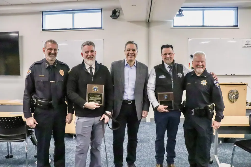Attorney General Raúl Labrador honors Detectives Payne and Mendenhall for their ICAC milestone. Photo credit: Attorney General Raúl Labrador/Facebook