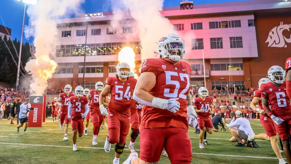 Players run onto Gesa Field prior to a home football game against San Diego State on Saturday, Sept. 6, 2025 (photo by Robert Hubner, WSU Photo Services).
