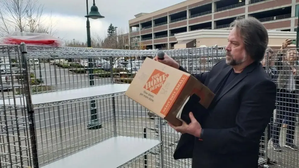 Let’s Go Washington founder Brian Heywood loads the first box of Initiative 2081 signatures. Photo: Brett Davis / The Center Square