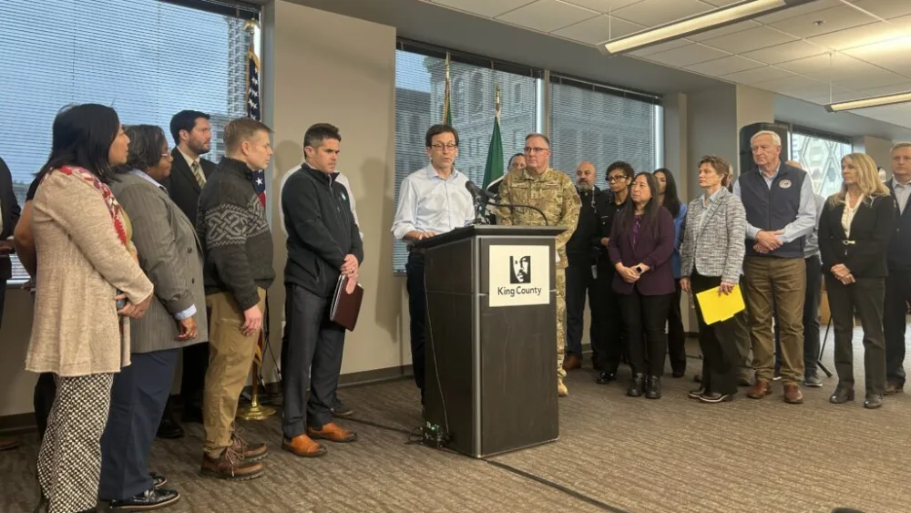 Washington Gov. Bob Ferguson speaks to the media at a press conference on flooding alongside state and local officials in Seattle on Tuesday, Dec. 16, 2025. (Photo by Jake Goldstein-Street/Washington State Standard)