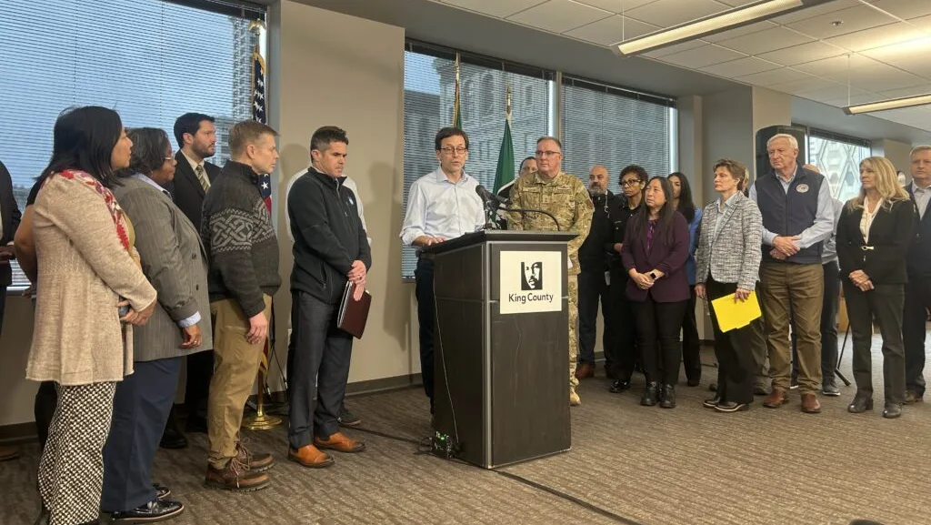 Washington Gov. Bob Ferguson speaks to the media at a press conference on flooding alongside state and local officials in Seattle on Tuesday, Dec. 16, 2025. (Photo by Jake Goldstein-Street/Washington State Standard)