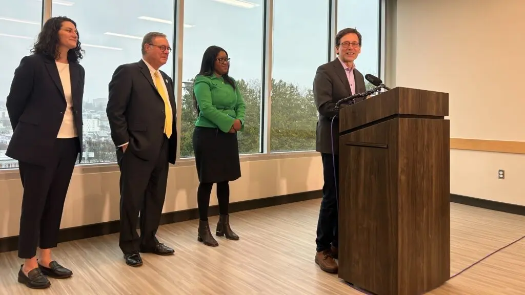 Washington Gov. Bob Ferguson announces proposed housing investments in a press conference in Seattle, alongside, from left to right, state Sen. Emily Alvarado, Lt. Gov. Denny Heck and Housing Development Consortium Executive Director Patience Malaba on Thursday, Dec. 18, 2025. (Photo by Jake Goldstein-Street/Washington State Standard)