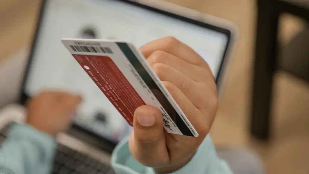 Photo by Kindel Media: https://www.pexels.com/photo/close-up-shot-of-a-person-holding-a-credit-card-6994154/