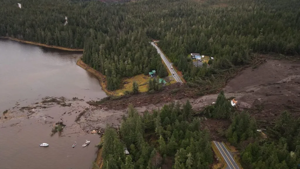 The deadly landslide that crashed through the outskirts of Wrangell on the night of Nov. 20, 2023, is seen from the air on the following day. The landslide killed six people and blocked a major road, the Zimovia Highway. The slide was triggered by heavy rain carried north by an atmospheric river. (Photo provided by Alaska Department of Transportation and Public Facilities)