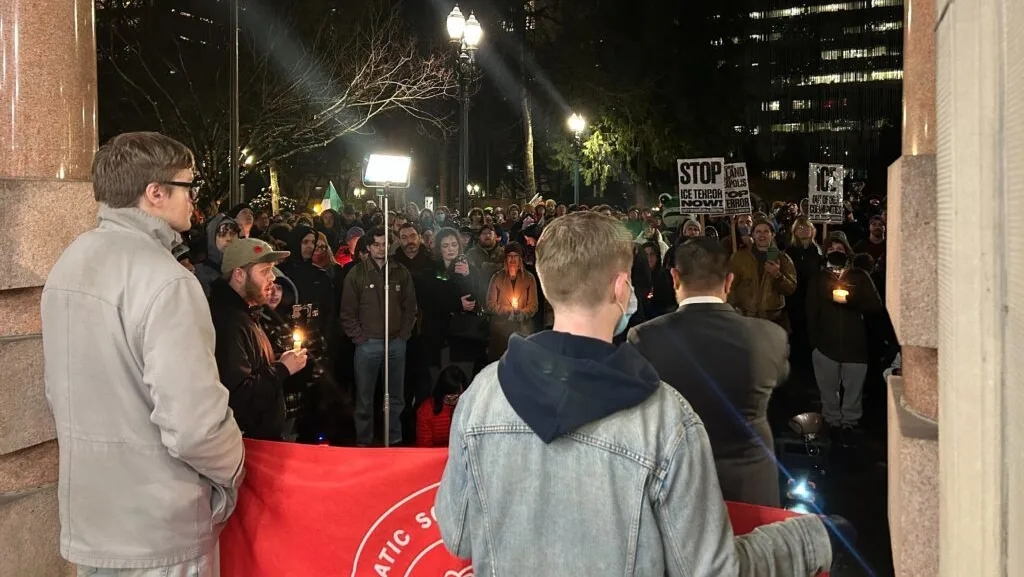 Portlanders gathered outside Portland City Hall on Thursday, Jan. 8, for a candlelight vigil and protest after federal officers shot two people. (Photo by Shaanth Nanguneri/Oregon Capital Chronicle)