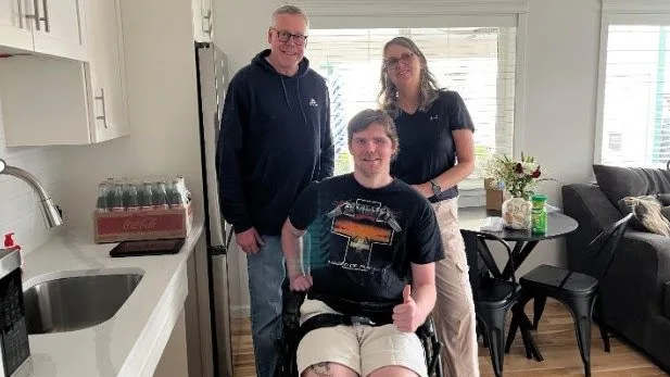 Justin and his parents, Joe and Dawn, settling into the newly renovated living space at the Shaw home in Boise. 20251216-FS-EAB-Shaw3 Photo Credit: USDA Forest Service taken by Eric Britton