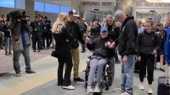 Justin arriving at Boise Airport greeted by friends and family. 20251216-FS-EAB-Shaw1 Photo Credit: USDA Forest Service taken by Eric Britton 