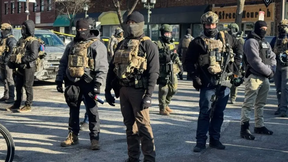Masked federal agents on the scene near where a federal officer shot a Minnesotan for the third time in as many weeks. (Photo by Madison McVan/Minnesota Reformer)