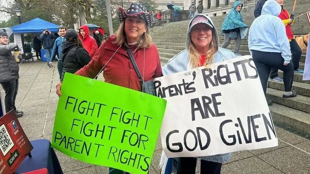 Supporters hold signs advocating for parental rights during a rally at the Washington State Capitol in Olympia, Feb. 5, 2025. Photo: Carleen Johnson / The Center Square