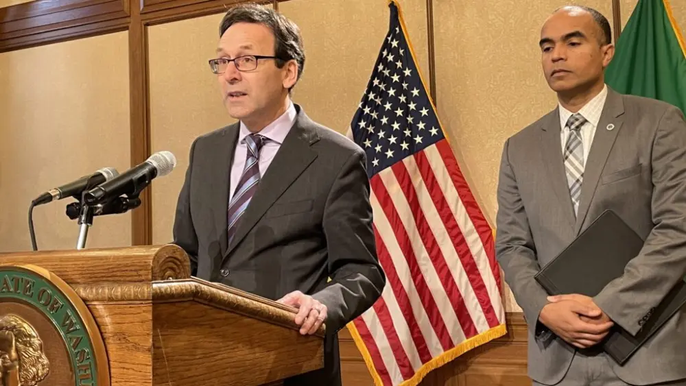 Washington Gov. Bob Ferguson discusses preparations that he and state Attorney General Nick Brown, right, are preparing if federal law enforcement agents conduct immigration activities similar to what’s occurred in Minnesota. Both are Democrats. (Photo by Jerry Cornfield/Washington State Standard)